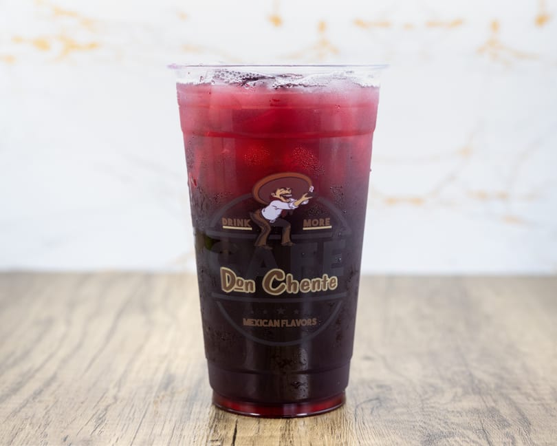 A clear plastic cup of iced red drink with the Don Chente Mexican Flavors logo.